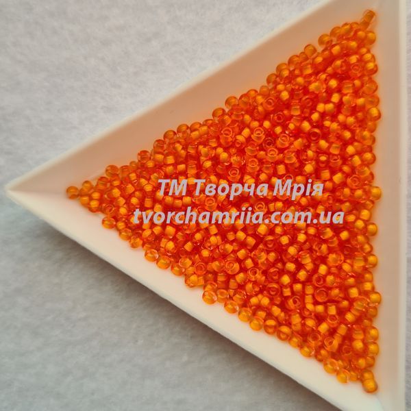 80983 Чеський бісер Preciosa 10/0 прозорий помаранчевий з промальованою серединкою 80983 фото