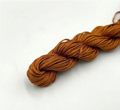 Нейлоновий шнур для плетіння браслетів 1 мм мідний 1 метр 000001692 фото
