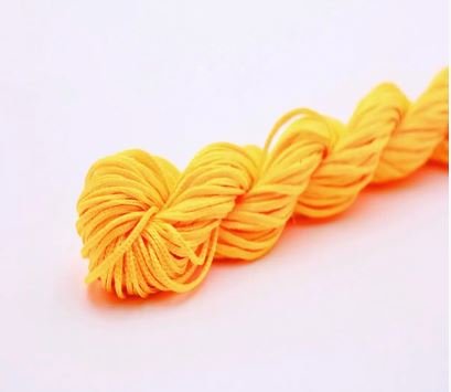 Нейлоновий шнур для плетіння браслетів 1 мм жовто-помаранчевий  1 метр 000001701 фото